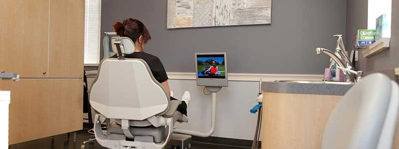 patient watching tv in dental chair