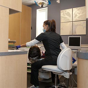 Dentist working with New patient